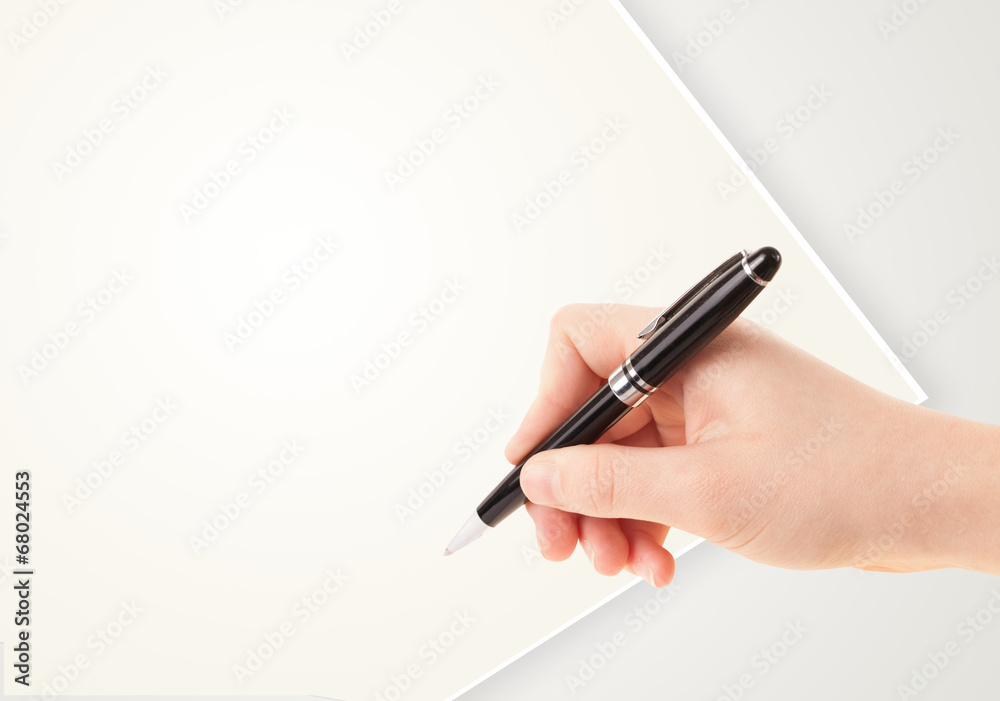 Hand writing on plain empty white paper copy space Hand writing on plain empty white paper copy space