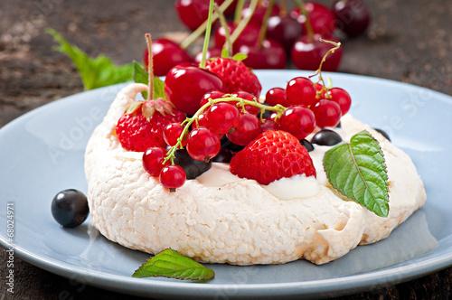 Cake  Pavlova  with cream and berries