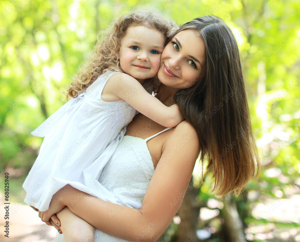 Portrait lovely mom and daughter in warm sunny summer day Portrait lovely mom and daughter in warm sunny summer day