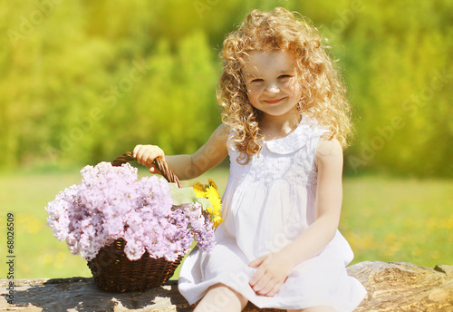 Summer sunny portrait charming curly little girl