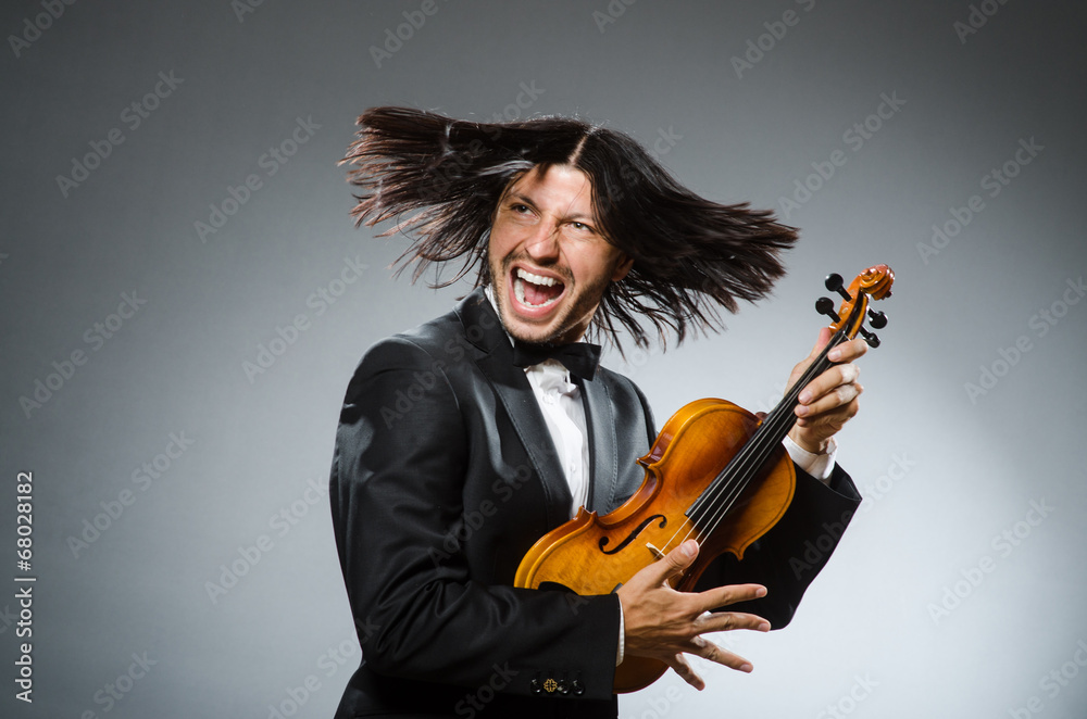 Fototapeta premium Man violin player in musican concept