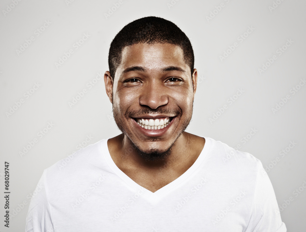 portrait of a smiling young man - obrazy, fototapety, plakaty 
