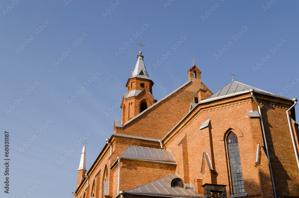 gothic church tower crosses on blue sky background