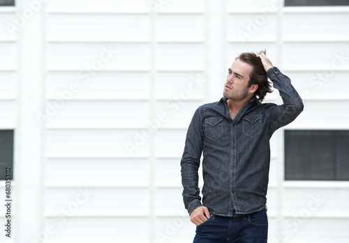 Male posing with hand in hair