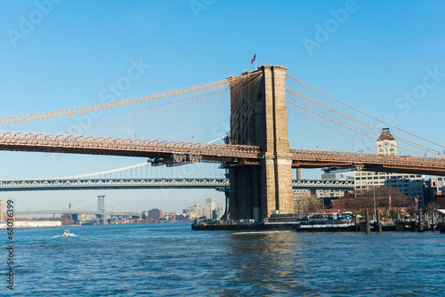 Brooklyn bridge in New York on bright summer day © Elnur