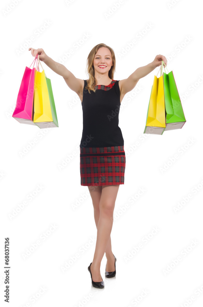 Woman after shopping spree on white