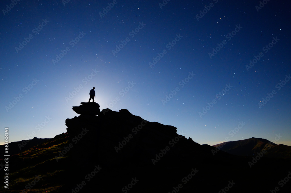 Man stands on a rock