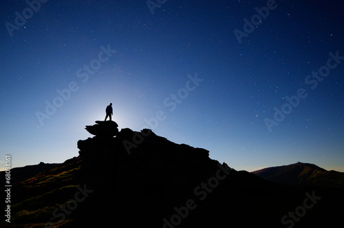 Man stands on a rock