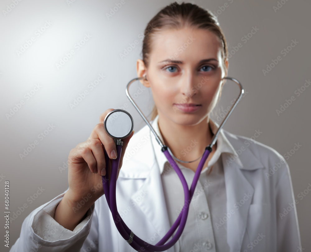 Close-up of female doctor using stethoscope Close-up of female doctor using stethoscope