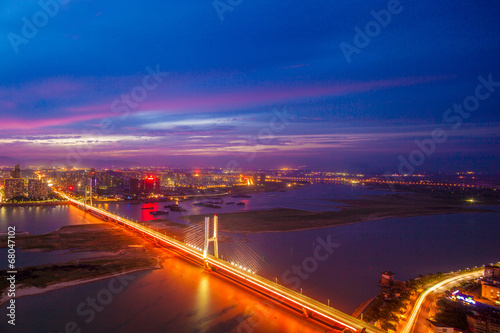 night view of the bridge and city in shanghai china. © zhangyang135769
