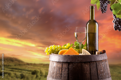 White wine with vineyard on background