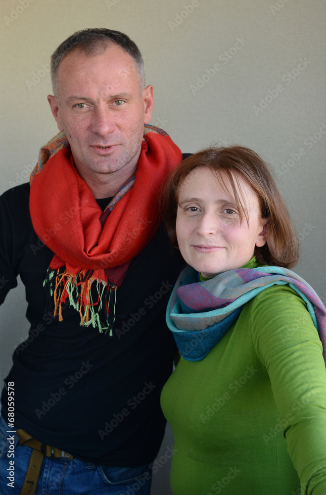 Couple in bright scarfs
