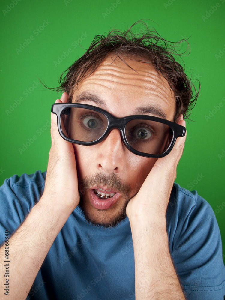 Thirty year old man with 3d glasses watching a movie Thirty year old man with 3d glasses watching a movie