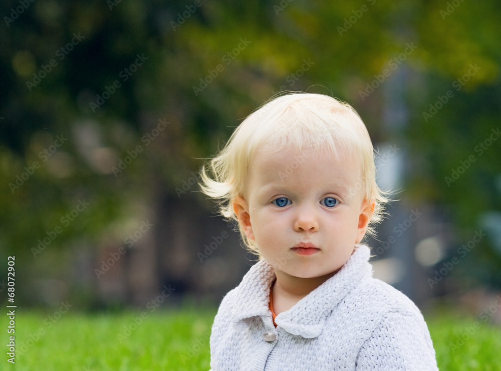Blond baby on field, summer autumn fall Blond baby on field, summer autumn fall