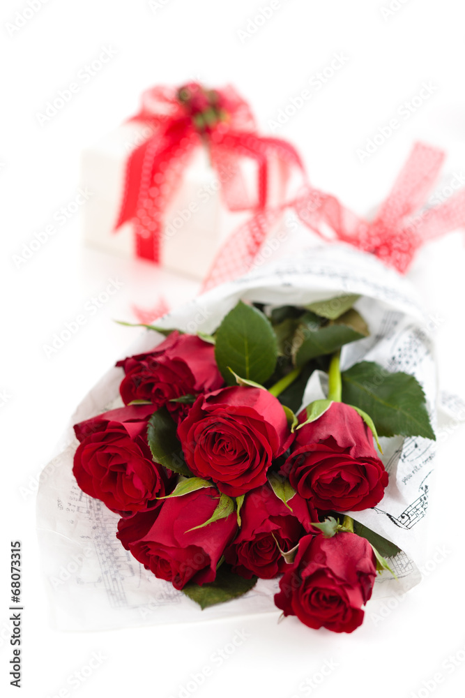 Roses and gift on white backgroung. Roses and gift on white backgroung.