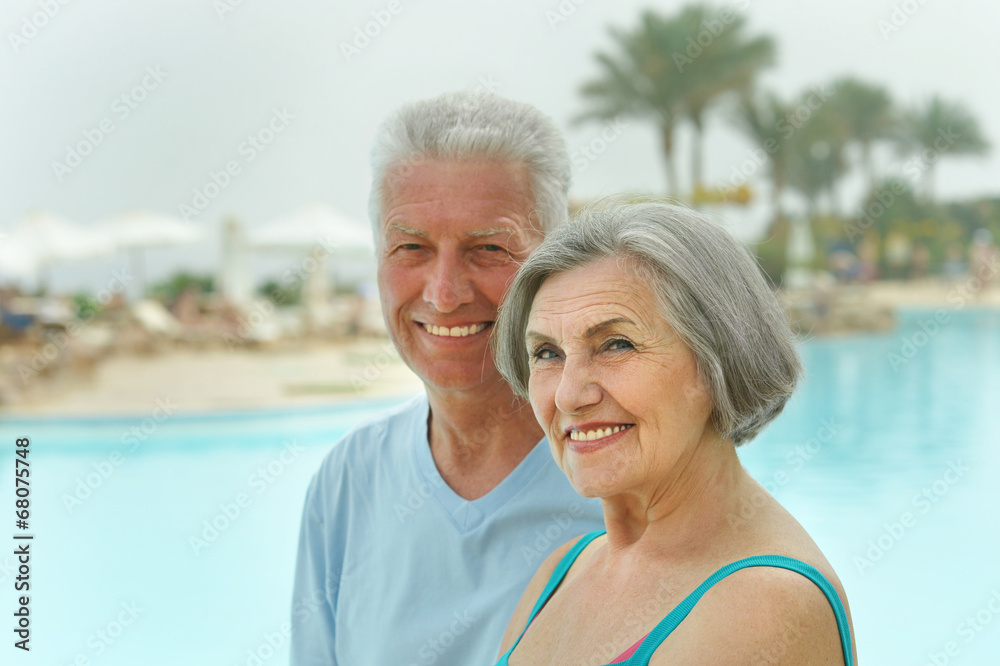 Senior couple by pool