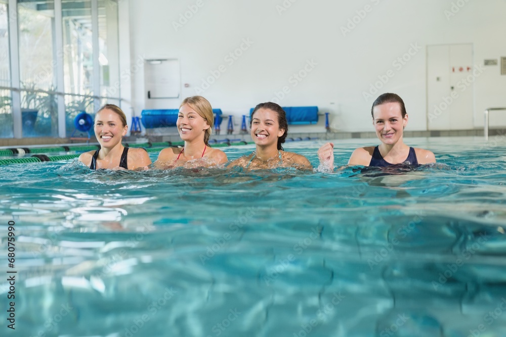 Fototapeta premium Female fitness class doing aqua aerobics