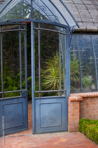 Fototapeta Naklejka Na Ścianę i Meble -  Old greenhouse in a French garden