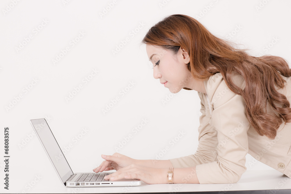 Portrait of a young business woman using laptop at office Portrait of a young business woman using laptop at office