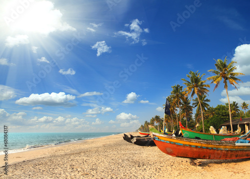 old fishing boats on beach in india photo