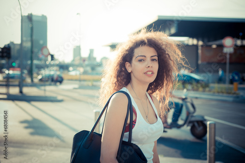 young beautiful long curly hair hipster woman