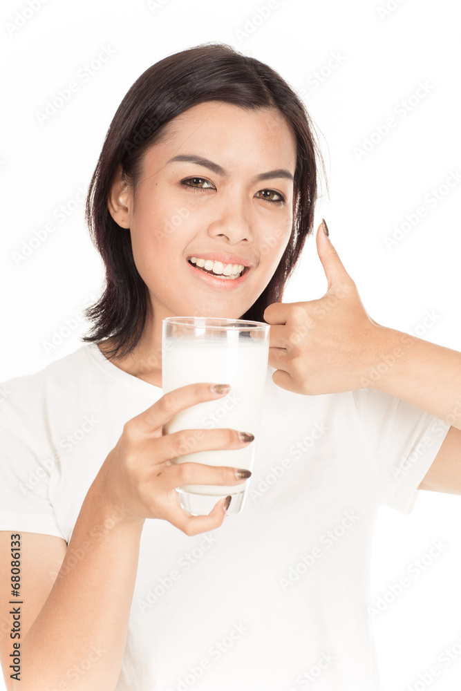 Laughing young woman with a glass of milk Laughing young woman with a glass of milk