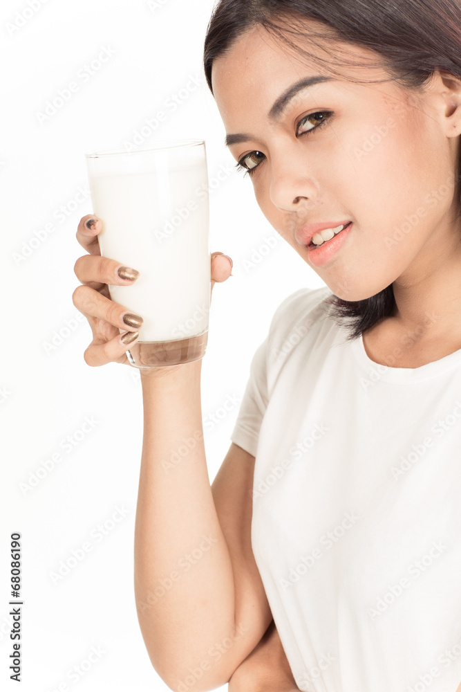 Laughing young woman with a glass of milk Laughing young woman with a glass of milk
