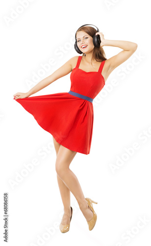 Woman in headpnones dancing listening to music. Girl portrait photo