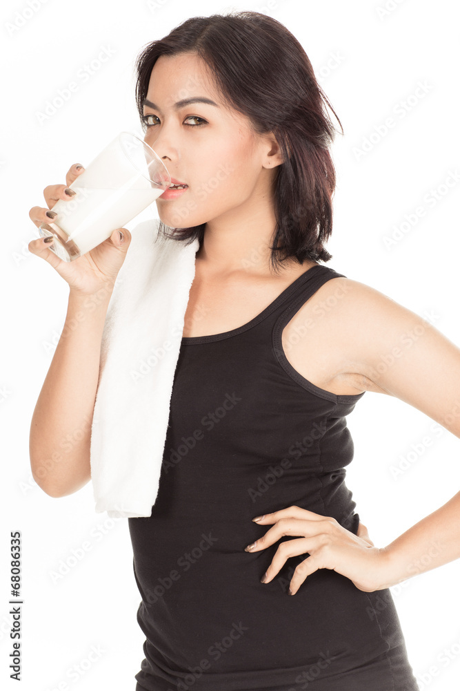 Laughing young woman with a glass of milk Laughing young woman with a glass of milk