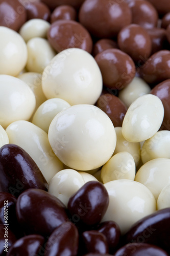 chocolate covered nuts and raisins background