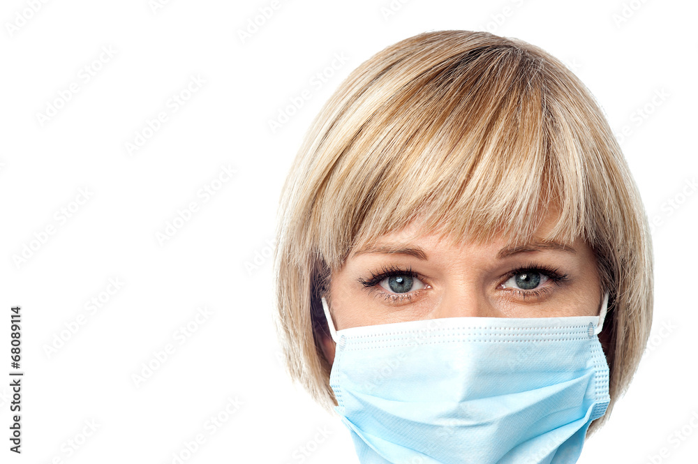 Female doctor wearing surgical mask Female doctor wearing surgical mask