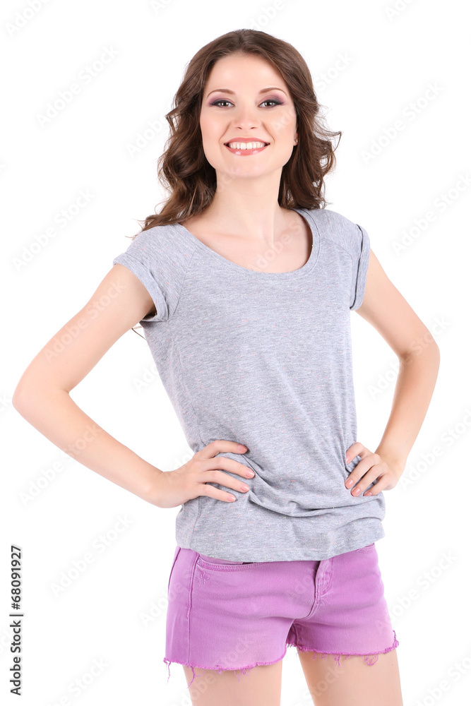 Obraz premium Beautiful young girl in shorts and t-shirt isolated on white