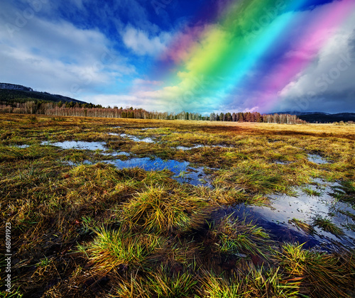 wet landscape with a rainbow