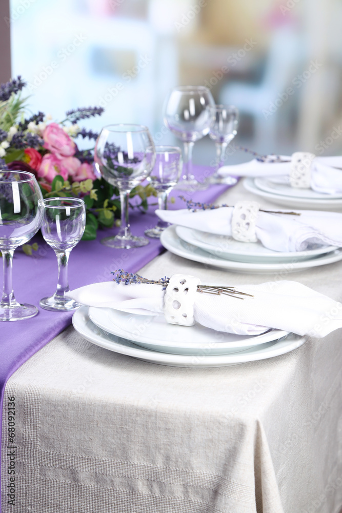 Dining table setting with lavender flowers Dining table setting with lavender flowers