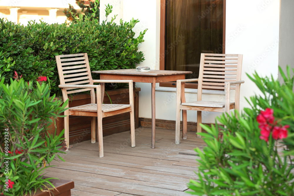 Street view of cafe terrace with table and chairs