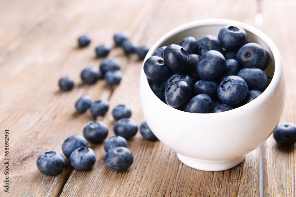 Delicious blueberries in bowl on table close-up Delicious blueberries in bowl on table close-up