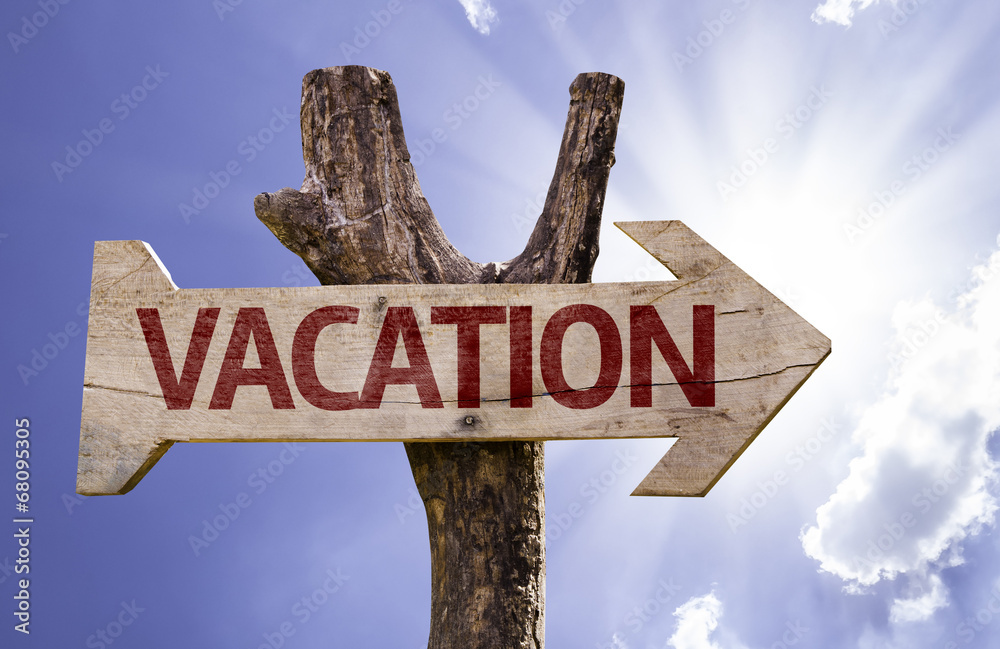 Vacation wooden sign on a beautiful day