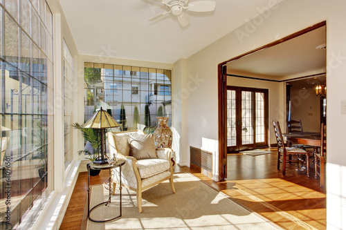 Bright sunroom with antique chair