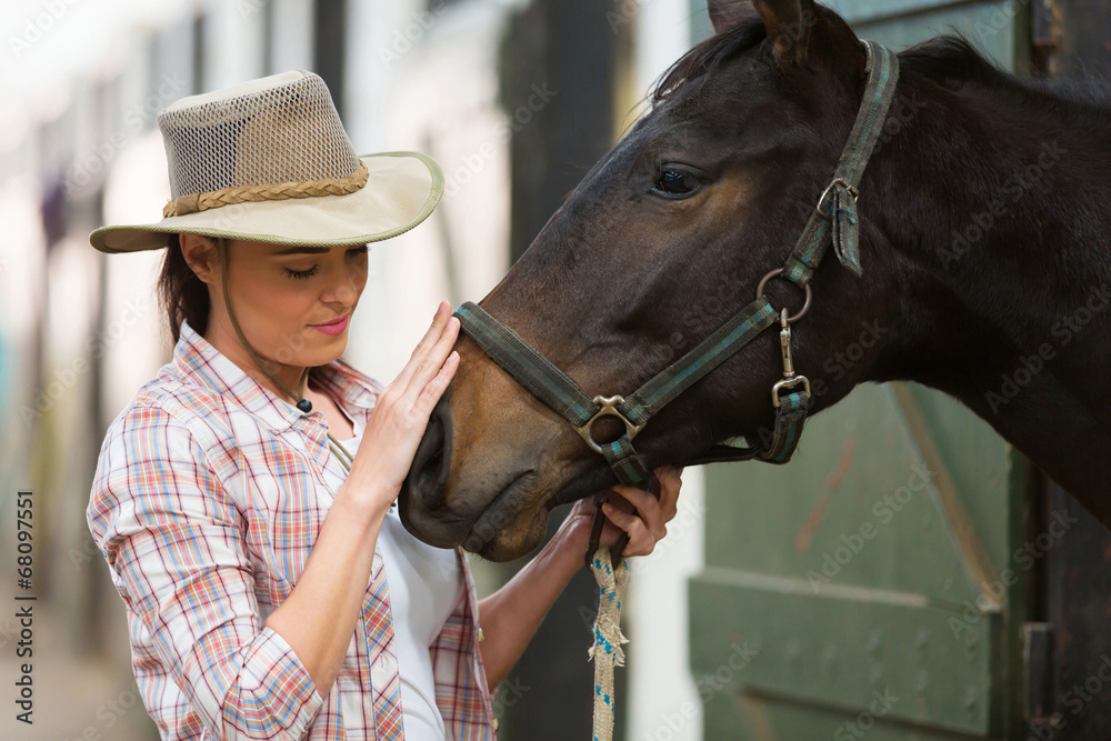 Obraz premium cowgirl talking to a horse