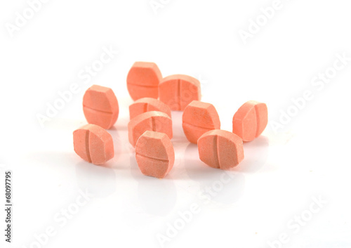 pill of vitamin C on white background photo