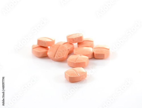 pill of vitamin C on white background