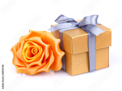 Yellow roses and golden gift box