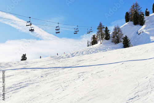 ski lift and slope of Dolomites mountains