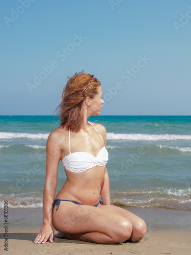 young woman relaxing on the beach © Netfalls