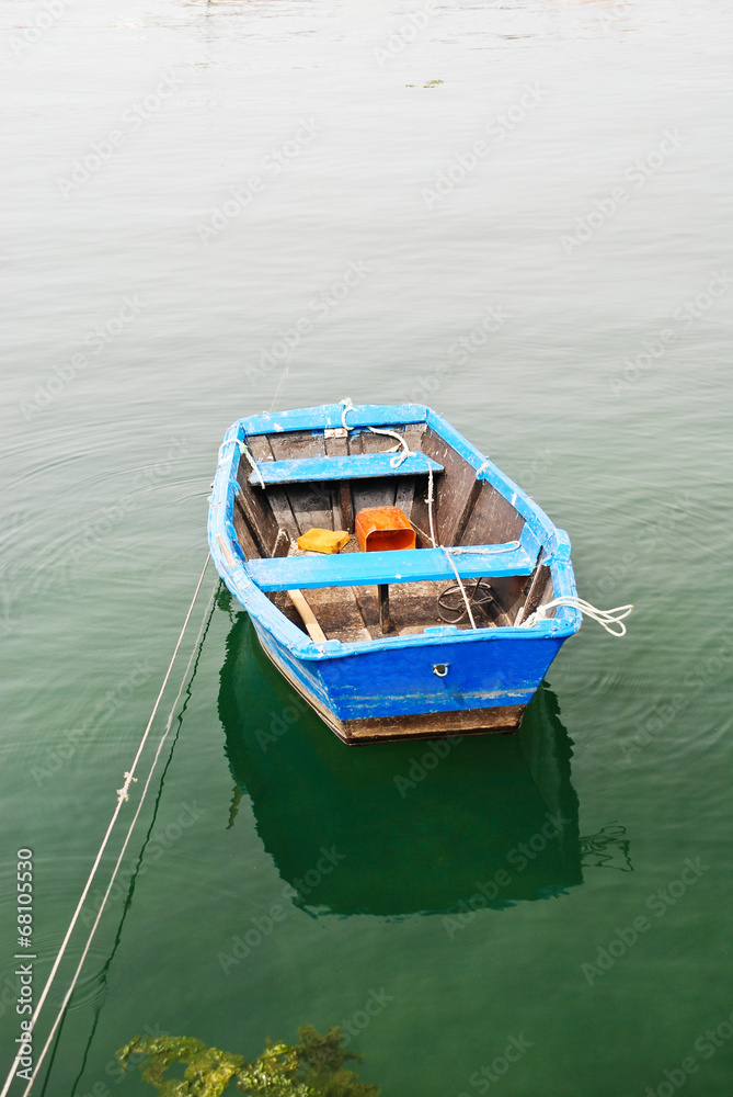 blue boat in water on Bay of Biscay