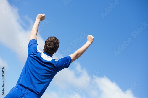 Football player in blue cheering © WavebreakmediaMicro