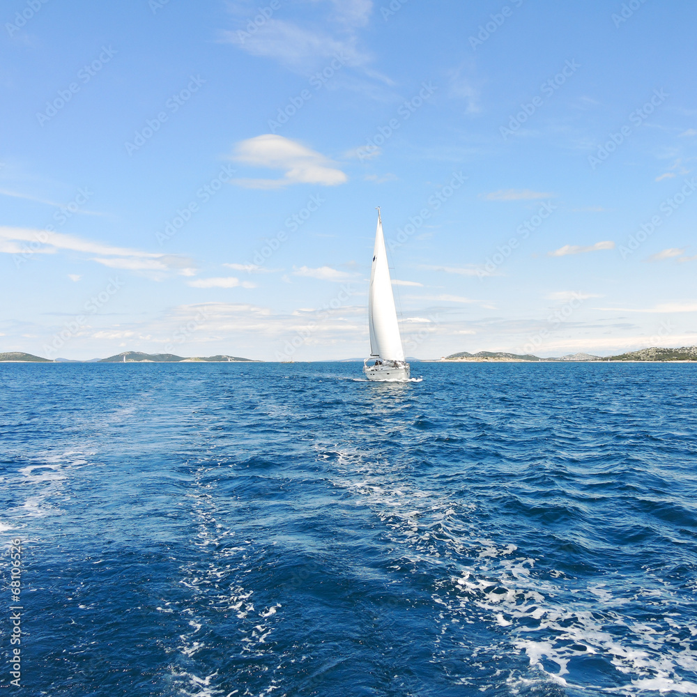 Obraz premium white sail yacht in blue Adriatic sea