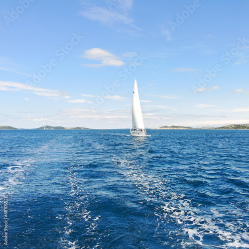 white sail yacht in blue Adriatic sea