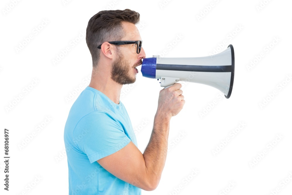 Handsome hipster talking through megaphone Handsome hipster talking through megaphone