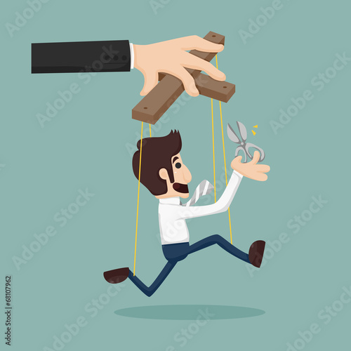 Cutting the strings of a business man puppet, giving it freedom